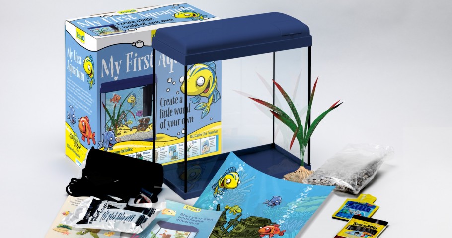 tetra my first aquarium set packaging design and marketing materials next to a fish tank